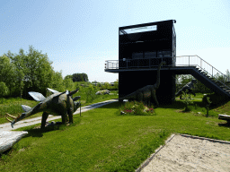 Statues of a Stegosaurus and a Diplodocus at the Dinopark area and the Spiegelzee building at the HistoryLand museum
