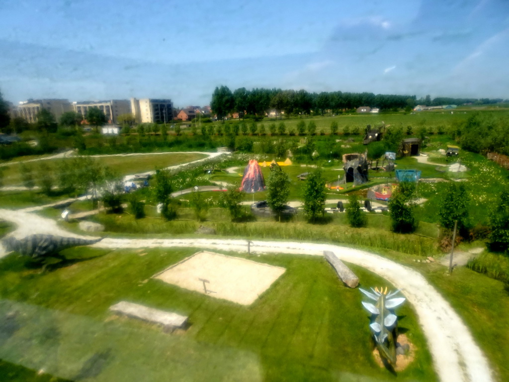 The Dinopark area and the miniature golf course at the HistoryLand museum, viewed through a window at the top floor of the Spiegelzee building