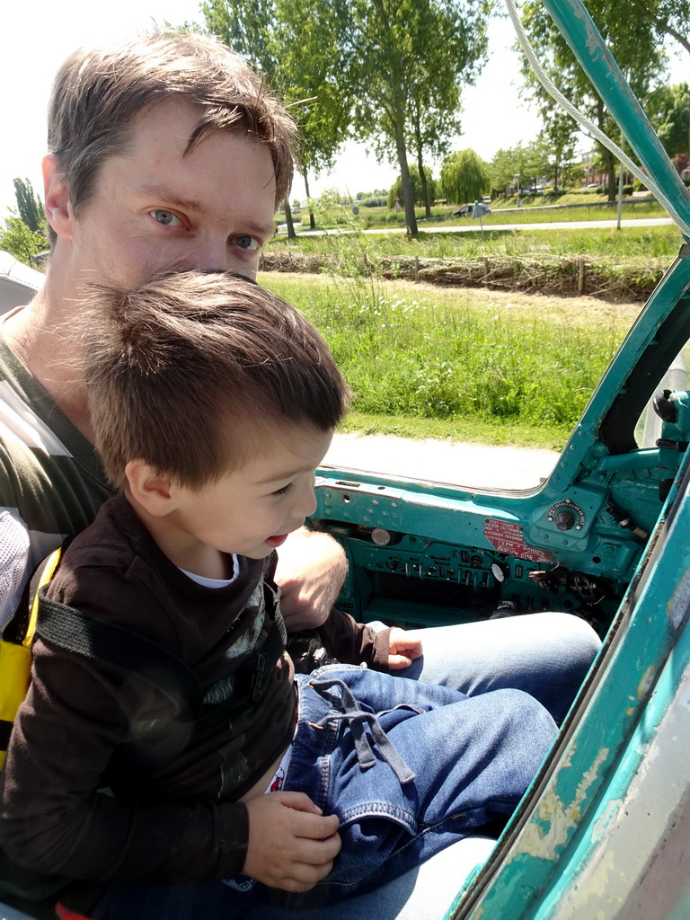 Tim and Max in the cockpit of the MIG-21M airplane at the HistoryLand museum