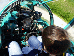 Max in the cockpit of the MIG-21M airplane at the HistoryLand museum