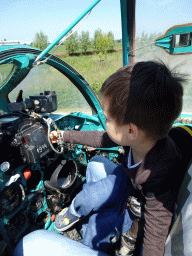 Max in the cockpit of the MIG-21M airplane at the HistoryLand museum