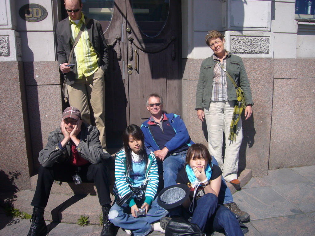 Miaomiao and her colleagues in front of a building at Market Square