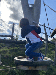 Max climbing on a rope bridge at the Bat Playground at the GeoFort