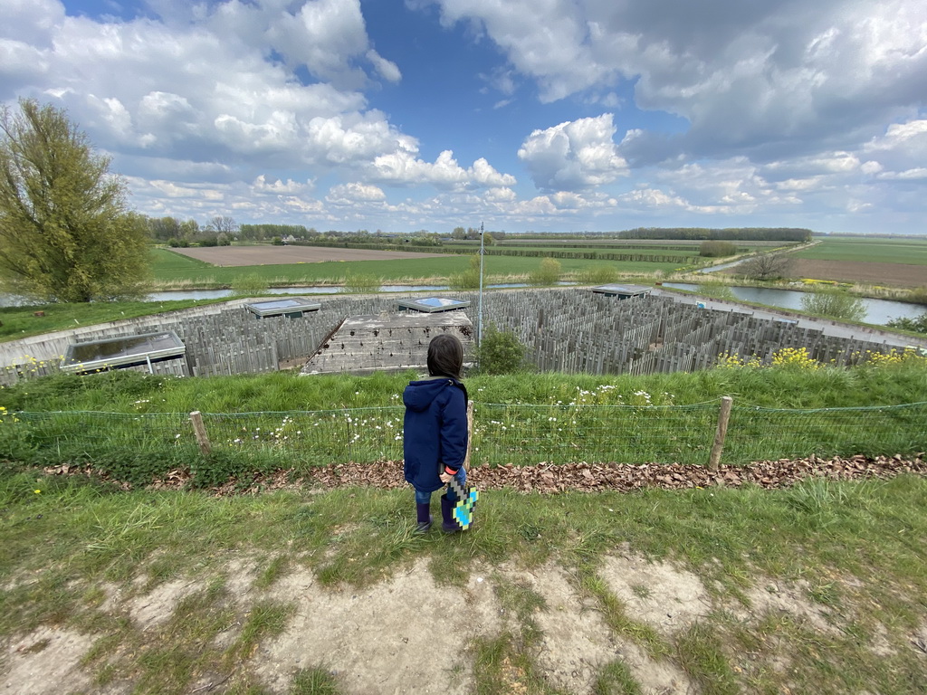 Max on the hill at the GeoFort, with a view on the Salmon Maze and the Elements Maze