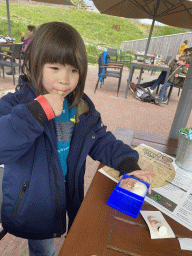 Max with an icecream at the terrace of the GeoFort Wereld pancake restaurant