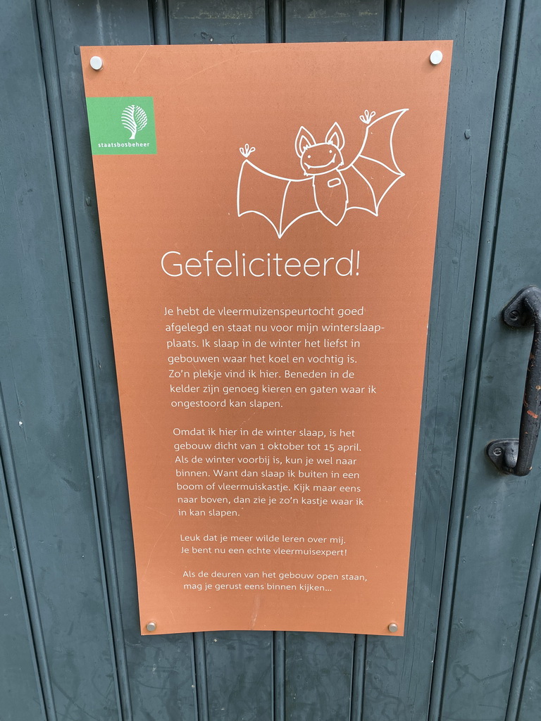 Sign about the Bat Scavenger Hunt at the front of the Bat Building at the GeoFort