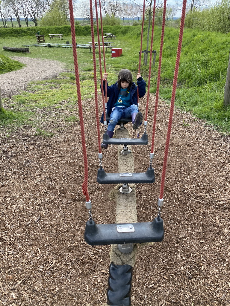 Max on a swing at the Bat Playground at the GeoFort