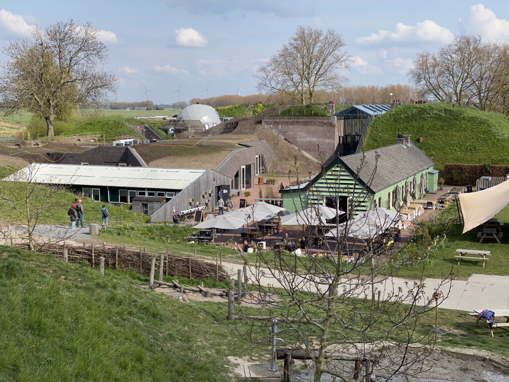 The GeoFort Wereld pancake restaurant, the Entrance Building and the northwest side of the Kazerne building of the GeoFort, viewed from the hill at the Bat Playground