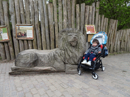 Max with a Lion statue at the Safaripark Beekse Bergen