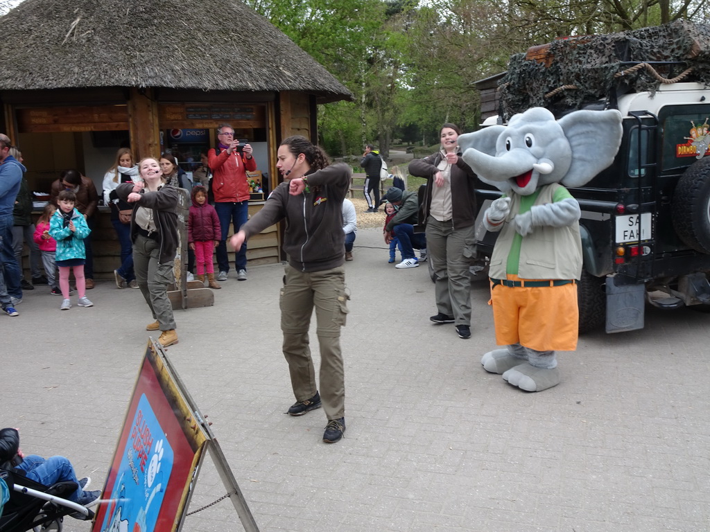 Mascot `Djambo` and people dancing during the Djambo Show near the Kongo restaurant at the Safaripark Beekse Bergen