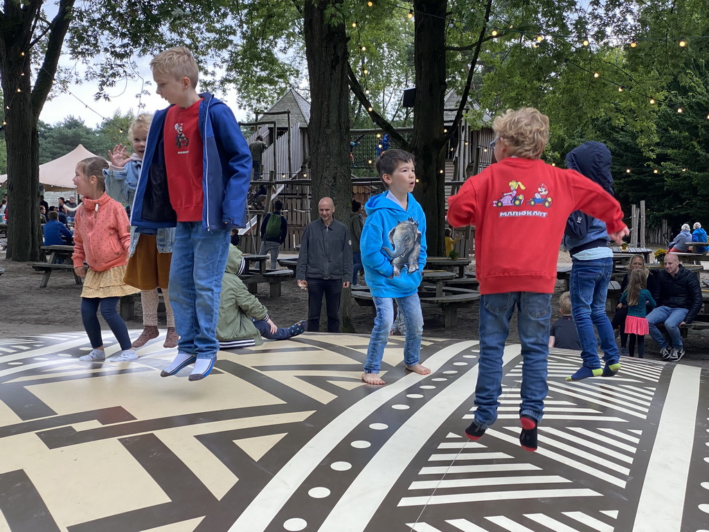 Max on the trampoline at the playground at the Kongoplein square at the Safaripark Beekse Bergen