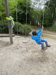 Max and his friend on a rope bridge at the playground near the Elephant enclosure at the Safaripark Beekse Bergen