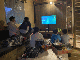 Miaomiao, Max and our friends playing `The Legend of Zelda: Skyward Sword` in the living room of our safari tent at the Safari Resort at the Safaripark Beekse Bergen