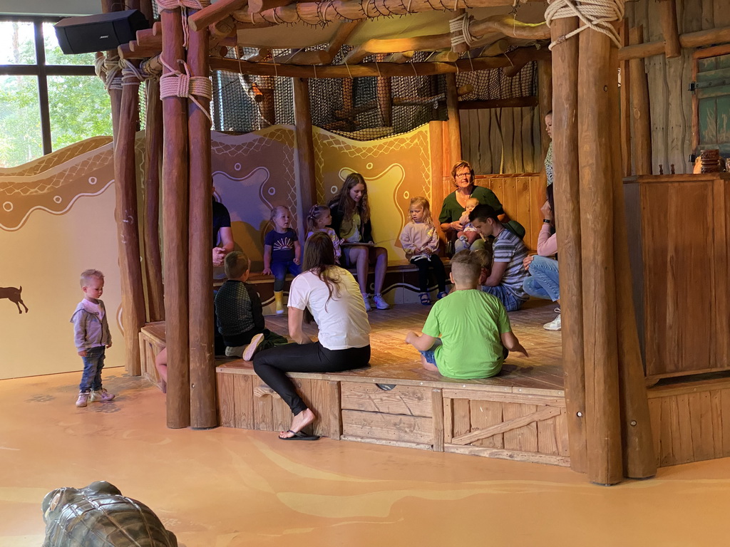 Ranger reading stories during `Welpjestijd` at the Ranger Basecamp playground at Karibu Town at the Safari Resort at the Safaripark Beekse Bergen