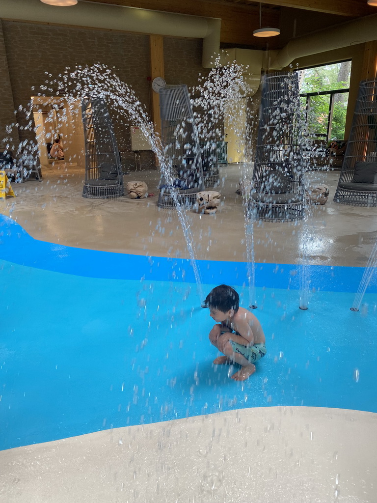 Max playing with water at the Maji Springs swimming pool at Karibu Town at the Safari Resort at the Safaripark Beekse Bergen