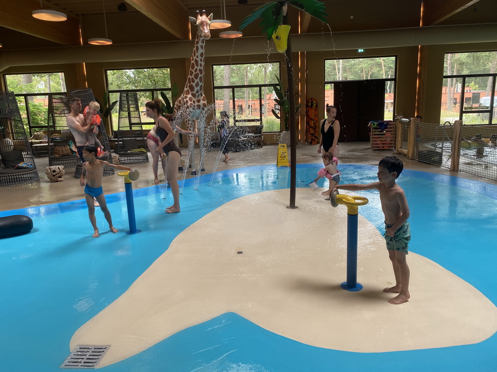 Max and his friend playing with water at the Maji Springs swimming pool at Karibu Town at the Safari Resort at the Safaripark Beekse Bergen