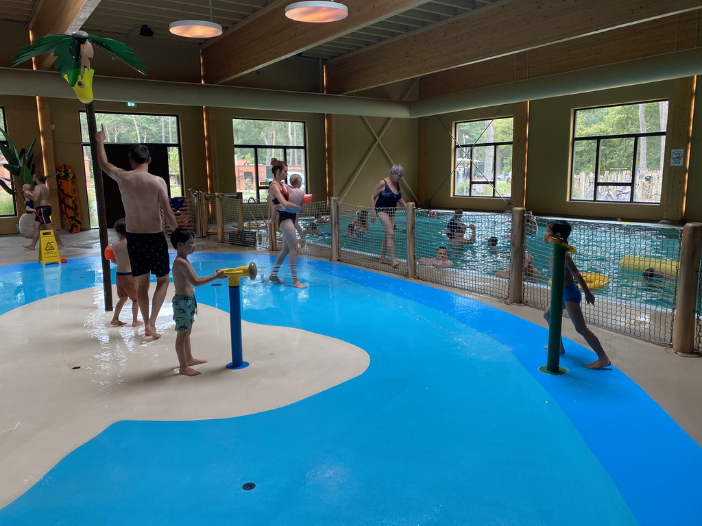 Max and his friend playing with water at the Maji Springs swimming pool at Karibu Town at the Safari Resort at the Safaripark Beekse Bergen