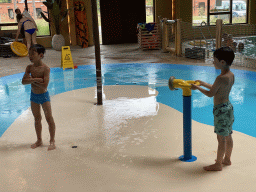 Max and his friend playing with water at the Maji Springs swimming pool at Karibu Town at the Safari Resort at the Safaripark Beekse Bergen