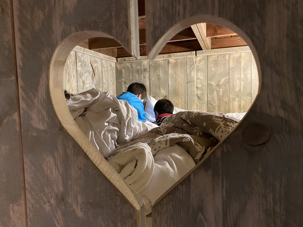 Max and his friend in the closet-bed in our safari tent at the Safari Resort at the Safaripark Beekse Bergen