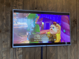 TV screen with `The Legend of Zelda: Skyward Sword` in the living room of our safari tent at the Safari Resort at the Safaripark Beekse Bergen