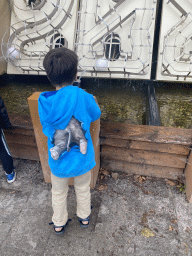 Max playing a water shooting game at Speelland Beekse Bergen