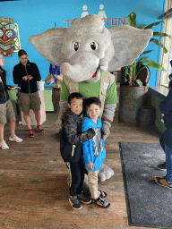 Max and his friend with the mascot `Djambo` at the restaurant at Speelland Beekse Bergen