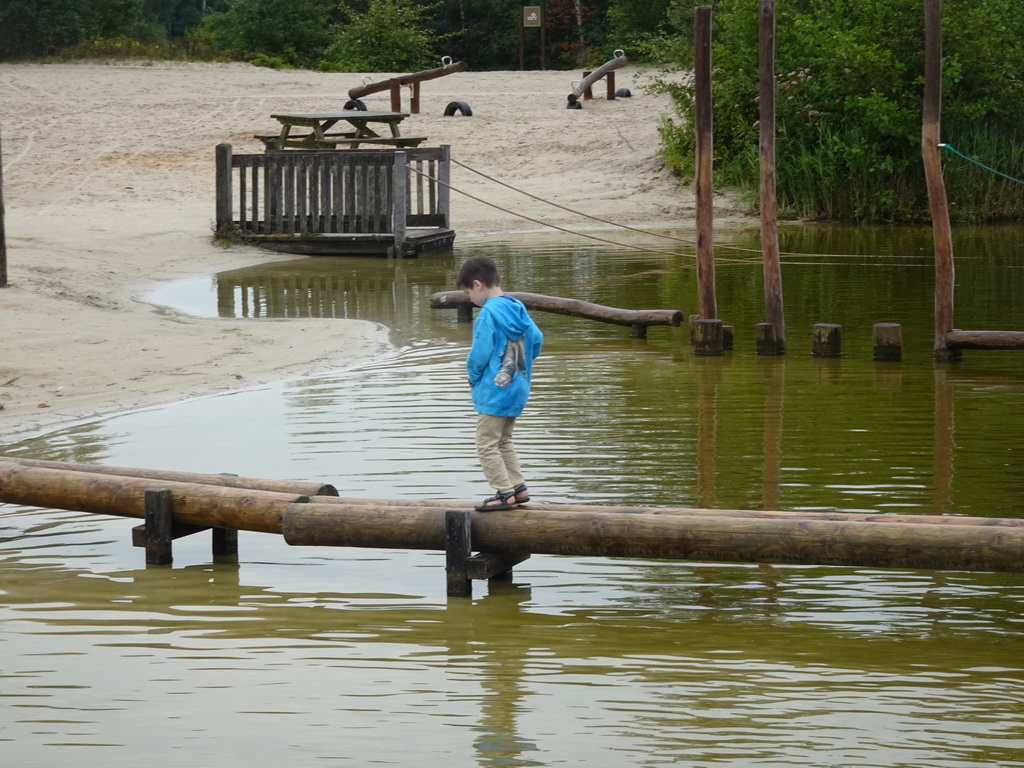 Max on a pole bridge from the Adventure Island to the Speelstraat playground at Speelland Beekse Bergen