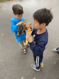 Max and his friend eating Spirellos at Speelland Beekse Bergen