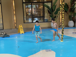 Max playing with water at the Maji Springs swimming pool at Karibu Town at the Safari Resort at the Safaripark Beekse Bergen
