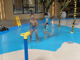 Max playing with water at the Maji Springs swimming pool at Karibu Town at the Safari Resort at the Safaripark Beekse Bergen