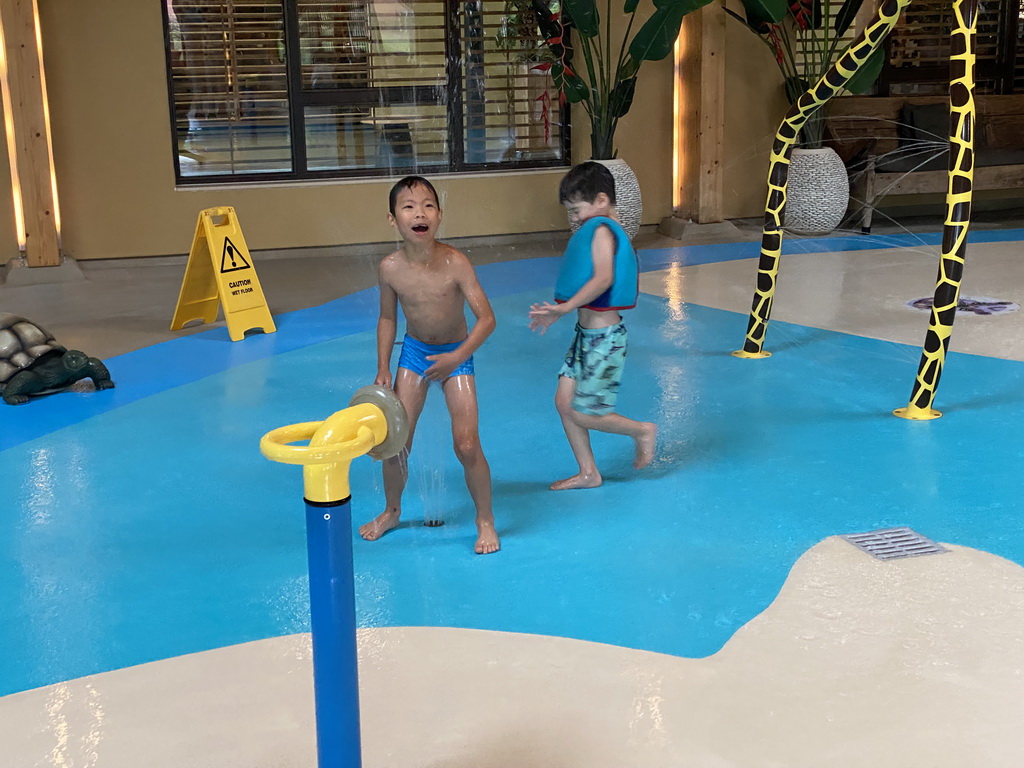 Max playing with water at the Maji Springs swimming pool at Karibu Town at the Safari Resort at the Safaripark Beekse Bergen