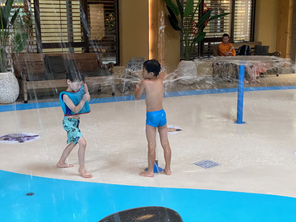 Max playing with water at the Maji Springs swimming pool at Karibu Town at the Safari Resort at the Safaripark Beekse Bergen