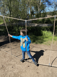 Max on a rope bridge at the playground at the Ring-tailed Lemur enclosure at the Safaripark Beekse Bergen