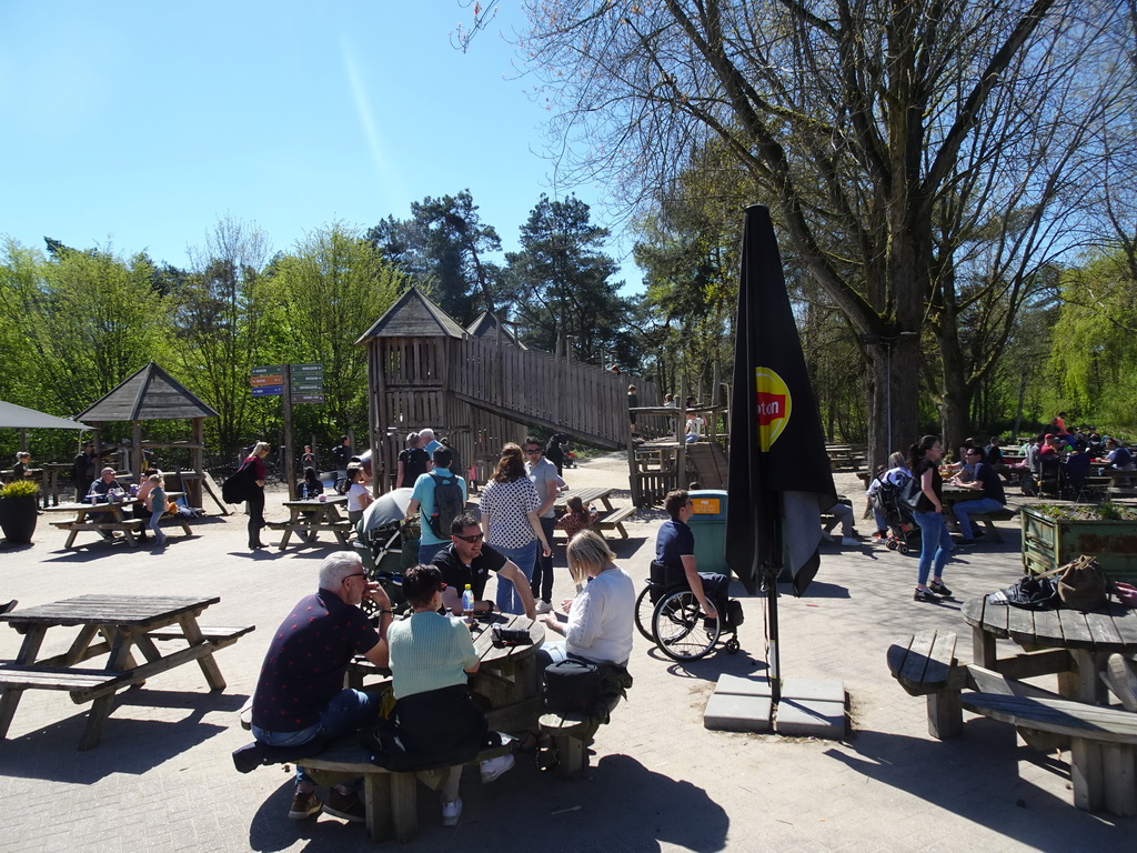 Terraces and playground at the Kongoplein square at the Safaripark Beekse Bergen