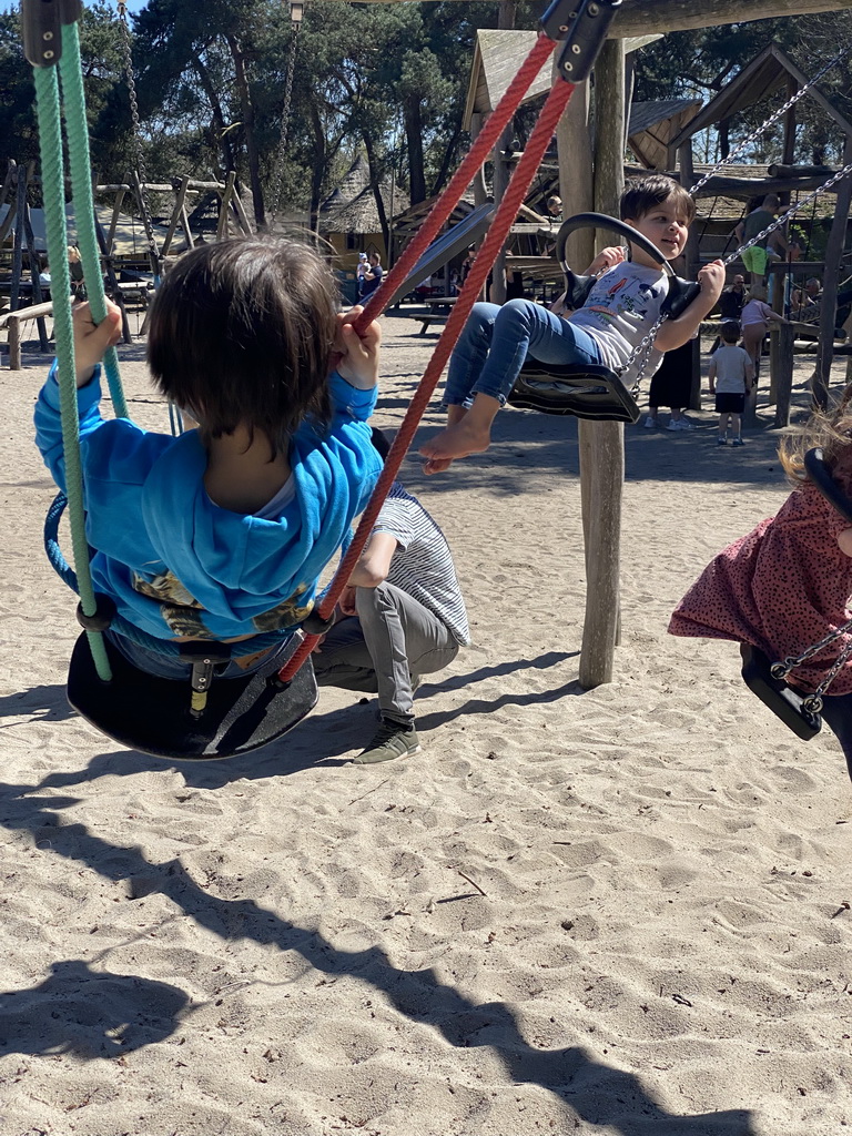 Max on a swing at the playground of the Afrikadorp village at the Safaripark Beekse Bergen