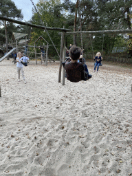 Max on a swing at the playground at the Afrikadorp village at the Safaripark Beekse Bergen