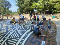 Max and his friends on the trampoline at the playground at the Kongoplein square at the Safaripark Beekse Bergen