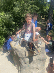 Max and his friends with a Crocodile statue in front of the Hippopotamus and Crocodile enclosure at the Safaripark Beekse Bergen