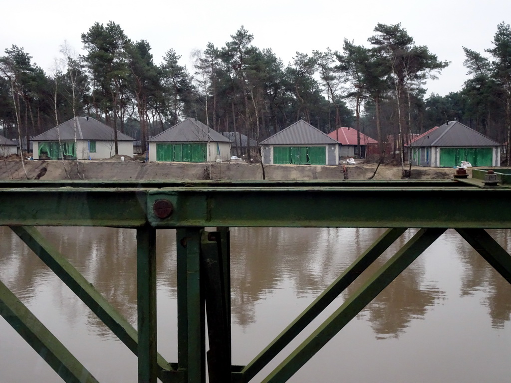 River and holiday homes of the Safari Resort at the Safaripark Beekse Bergen, under construction, viewed from the car during the Autosafari