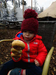 Max having lunch at the Wolkendroom area at the Safariplein square at the Safaripark Beekse Bergen, during the Winterdroom period