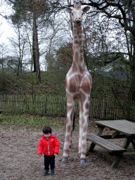 hilvarenbeek_2_126 - 476 kb - 768x1024 - Max with a Giraffe statue at the playground of the Afrikadorp village at the Safaripark Beekse Bergen, during the Winterdroom period Max with a Giraffe statue at the playground of the Afrikadorp village at the Safaripark Beekse Bergen, during the Winterdroom period