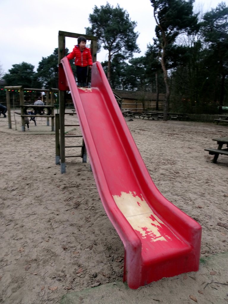 Max on the slide at the playground of the Afrikadorp village at the Safaripark Beekse Bergen, during the Winterdroom period