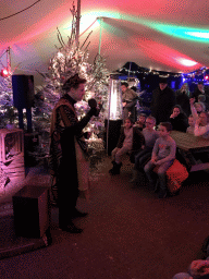 Story teller at the Verhalenverteller attraction at the Kongoplein square at the Safaripark Beekse Bergen, during the Winterdroom period, at sunset