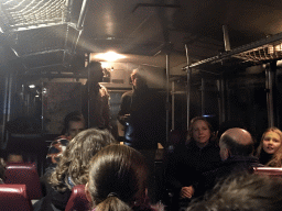 Tour guide and actor in the bus during the Winterdroom Night Bus Safari, by night