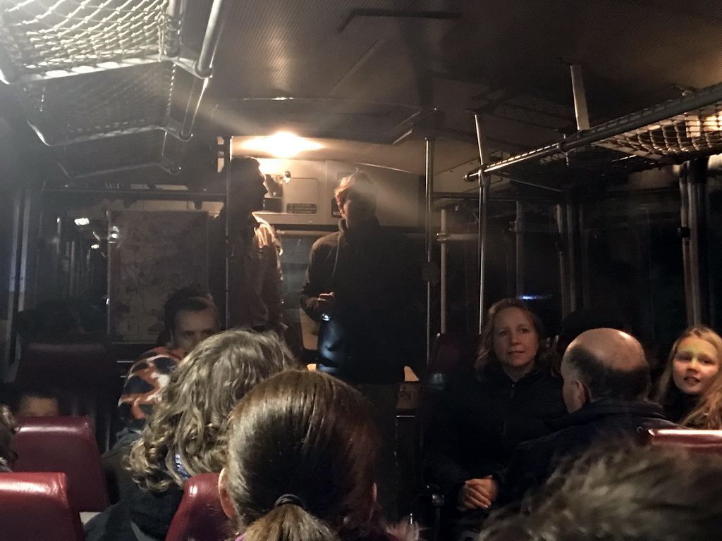 Tour guide and actor in the bus during the Winterdroom Night Bus Safari, by night