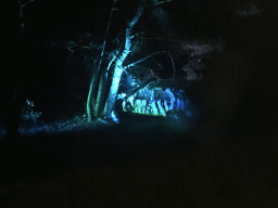 Safari Jeep parked against a tree at the Safaripark Beekse Bergen, viewed from the bus during the Winterdroom Night Bus Safari, by night