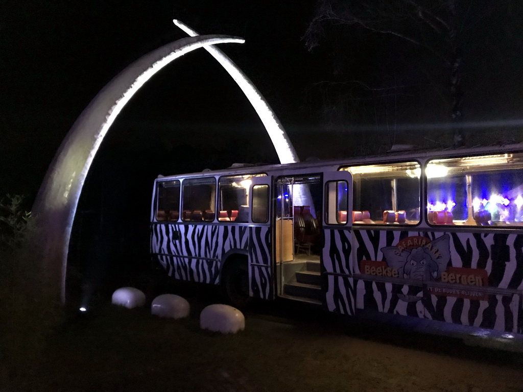 Gate and Safari Bus at the Safaripark Beekse Bergen, during the Winterdroom period, by night