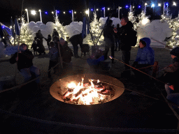 Bonfire with marshmallows at the Wolkendroom area at the Safariplein square at the Safaripark Beekse Bergen, during the Winterdroom period, by night