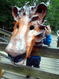Max with a lion mask at the playground near the Elephant enclosure at the Safaripark Beekse Bergen