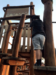 Max at the playground at Karibu Town at the Safari Resort at the Safaripark Beekse Bergen, at sunset